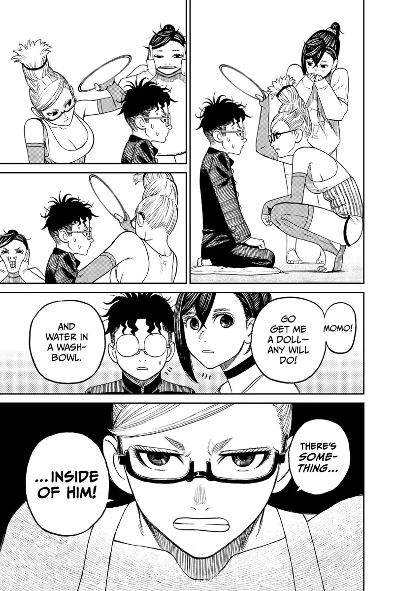 Grandma examines Okarun with a mirror. She tells Momo to get a doll and bring it to her, as something is inside him.