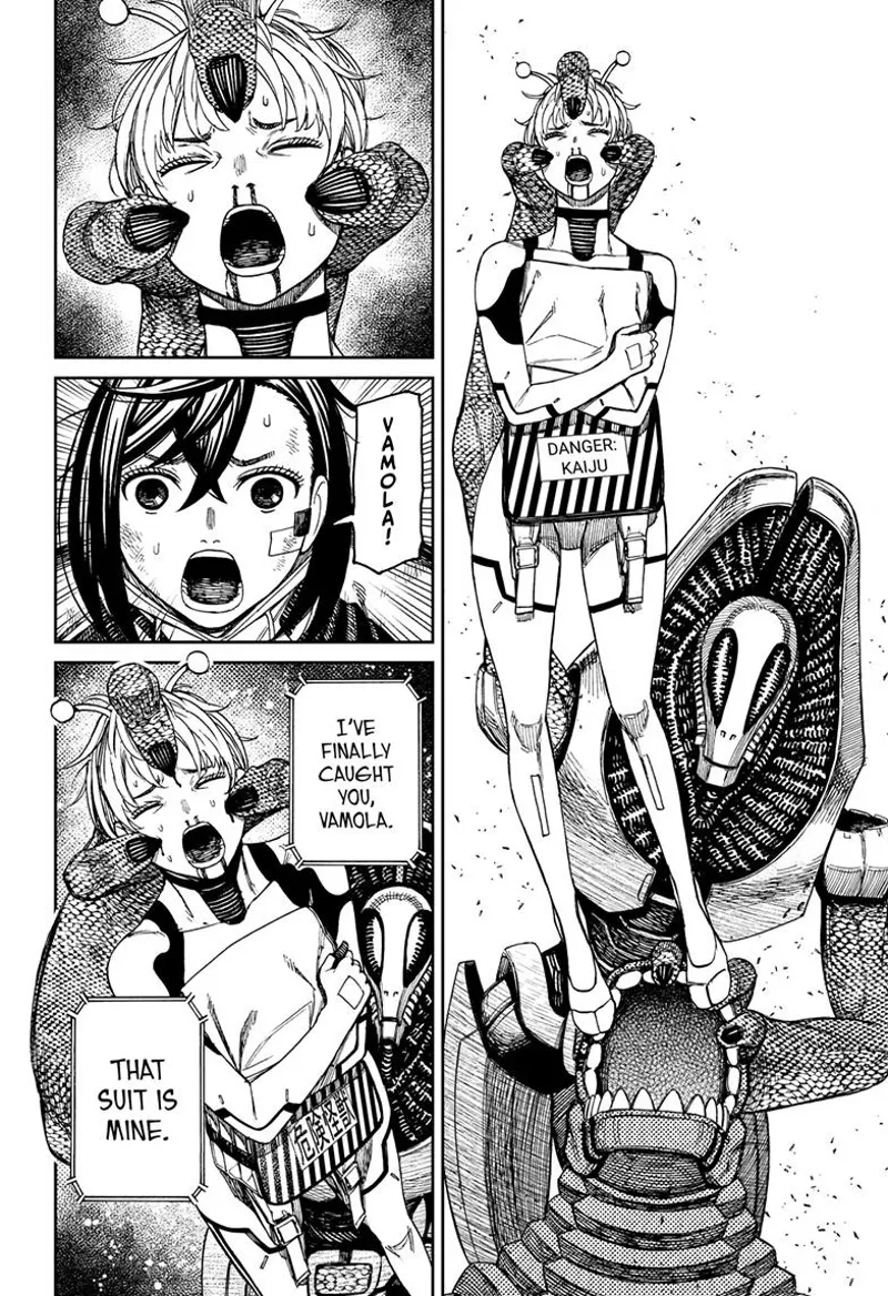 The alien leader holds the bloody Vamola on her head as he takes her suit.