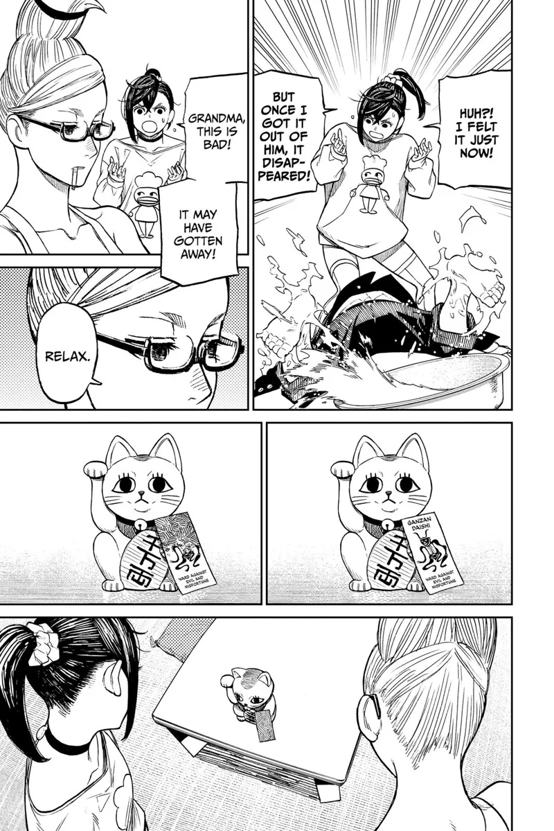 Okarun smashes into the floor. Momo says it's gone, and Grandma says it got away. The talisman on the doll kitten changes.