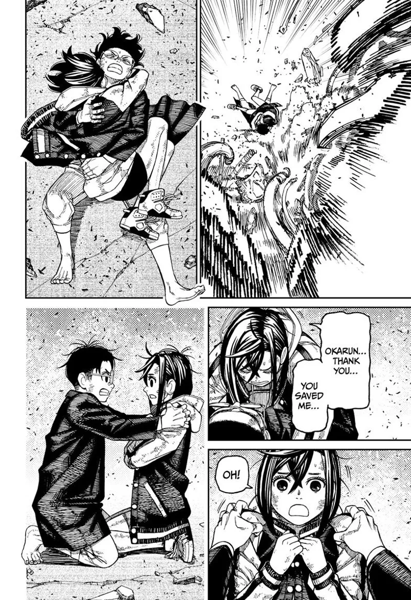 Momo and Okarun crash through the ground. Momo thanks Okarun for saving her.