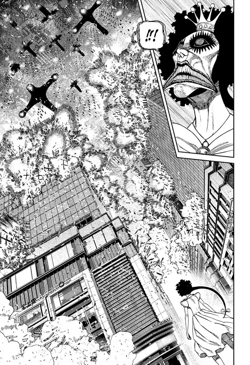 Reiko looks above and sees the alien ships flying and bombing the buildings.