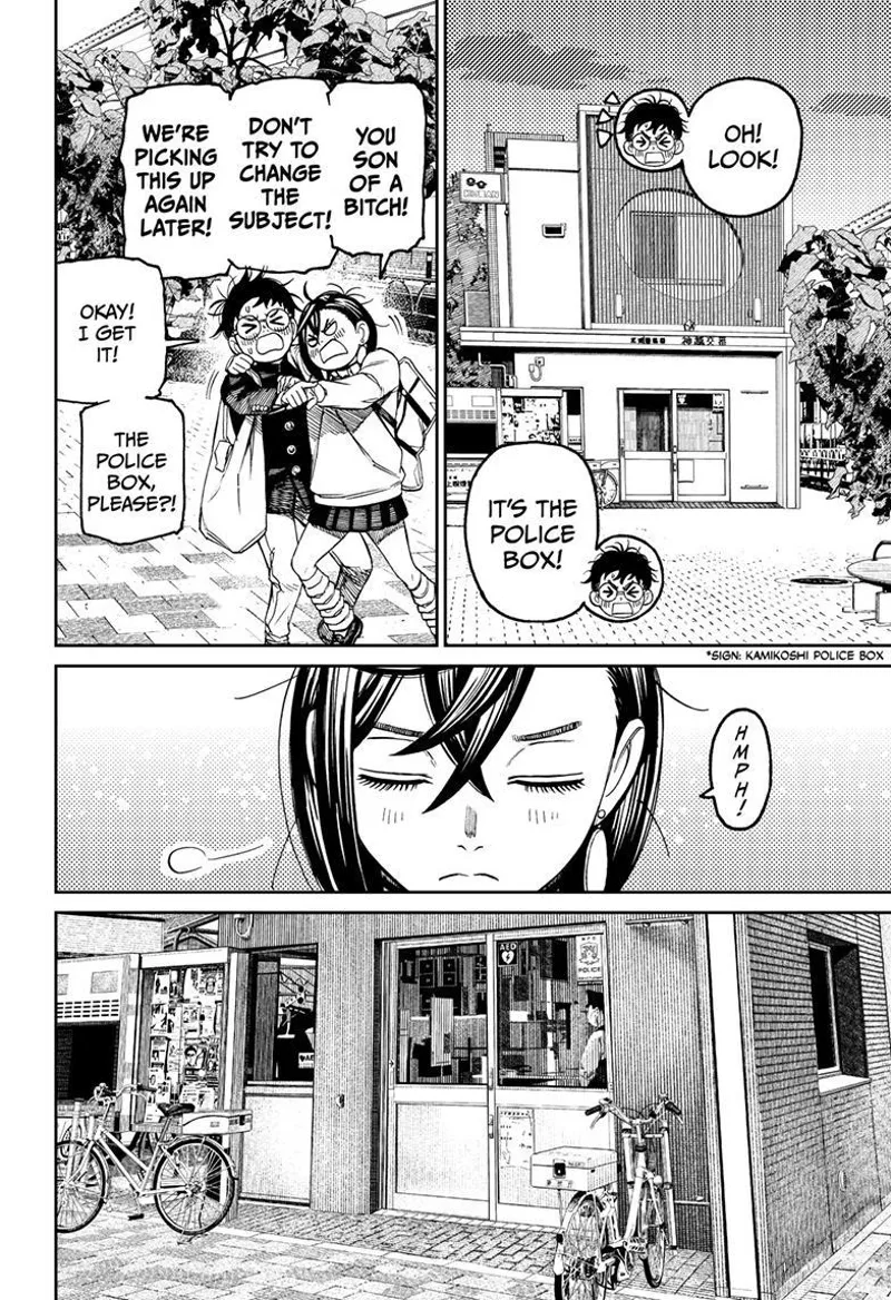 Okarun points at the police box. Momo focuses her attention on the police box.