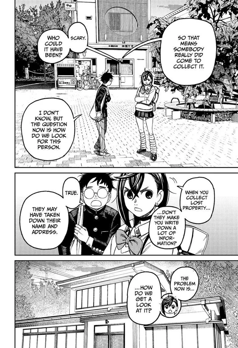 Momo and Okarun stand outside the police box. They realize somebody has already taken Okarun's nut.