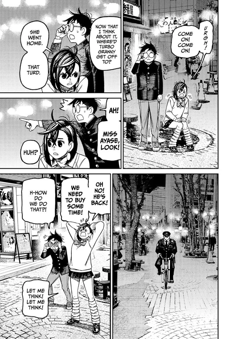 Momo and Okarun see the police coming back while riding a bike.