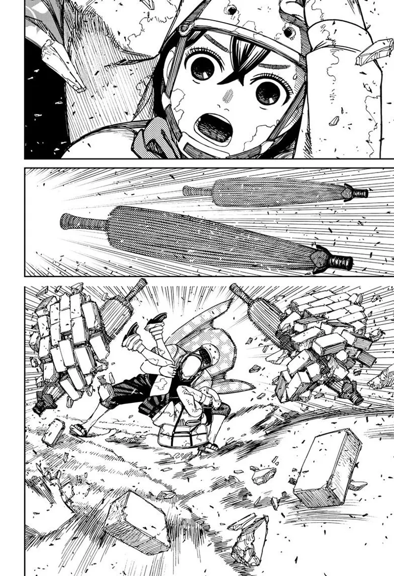 Momo is surprised. An umbrella-like weapon blocks the debris from hitting them.