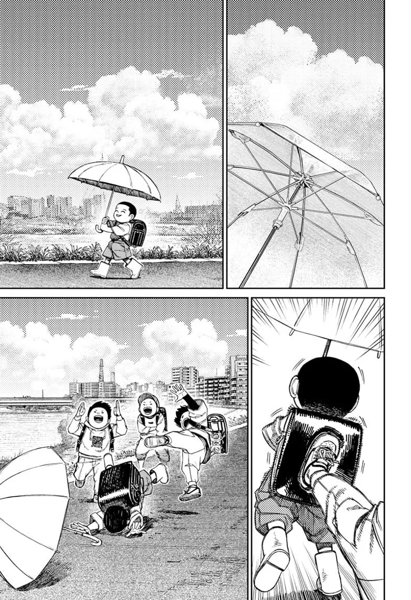 Unji's younger brother holds an umbrella while walking. Three kids bully him and kick him in the back.