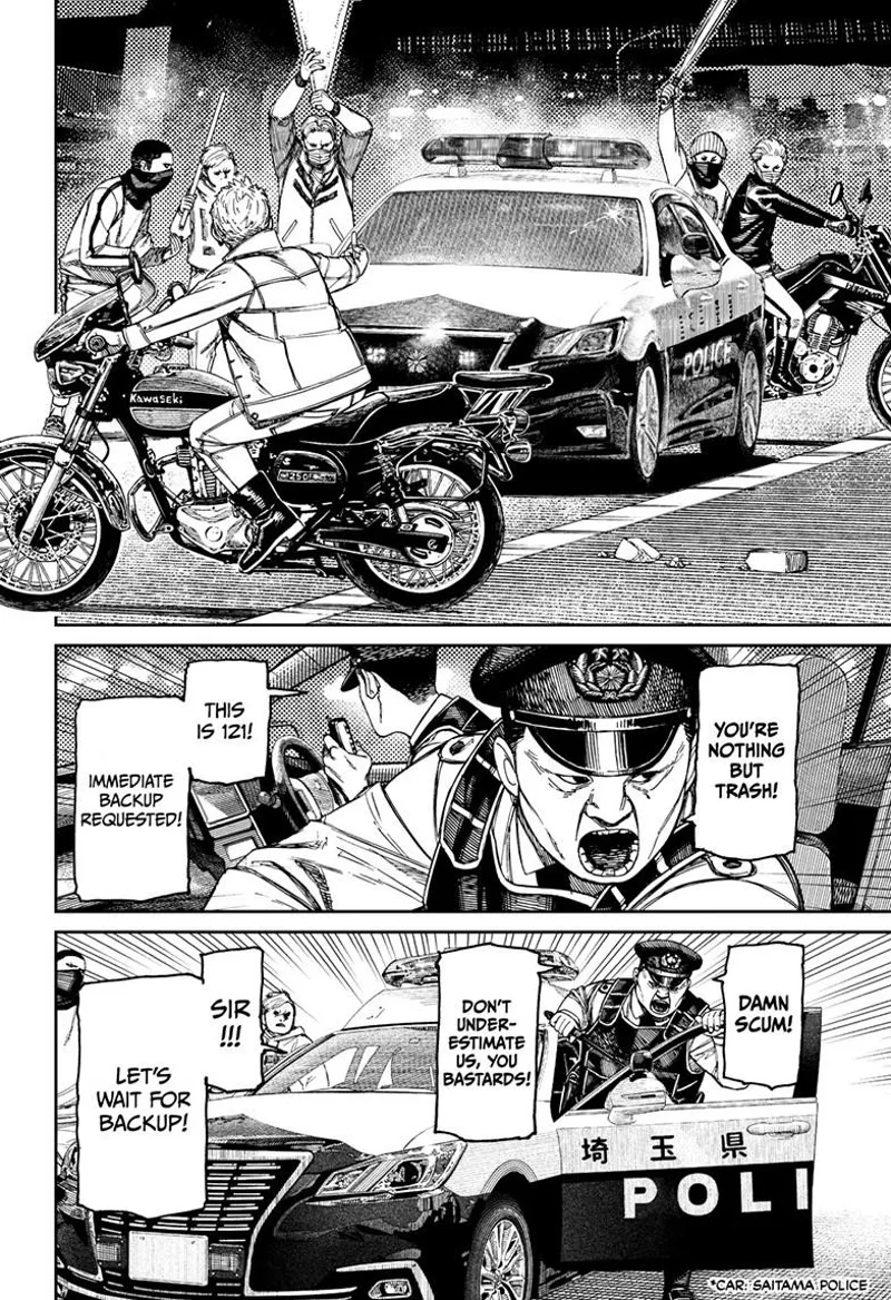 Zuma's gang blocks off a police officer. One of the cops gets out of the car to face the thugs.