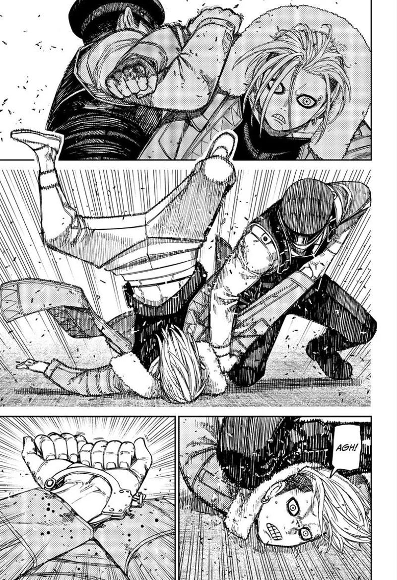 One of the cops subjugates Unji Zuma to the ground and cuffs his hands. He is surprised.