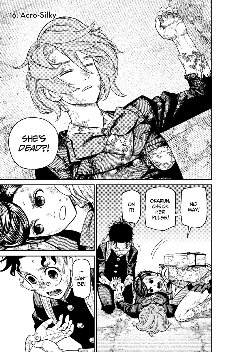 Aira is lying on the ground. Momo listens to her heartbeat, and Okarun checks her pulse. Aira is dead.