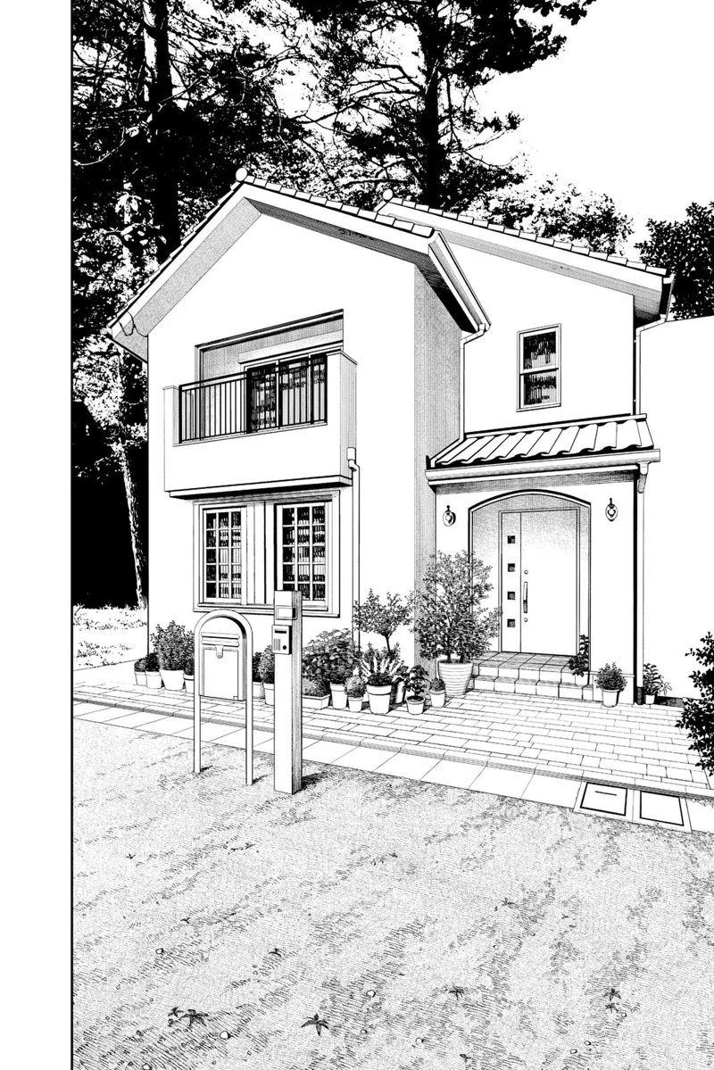 A nice simple house near the road with trees behind it.