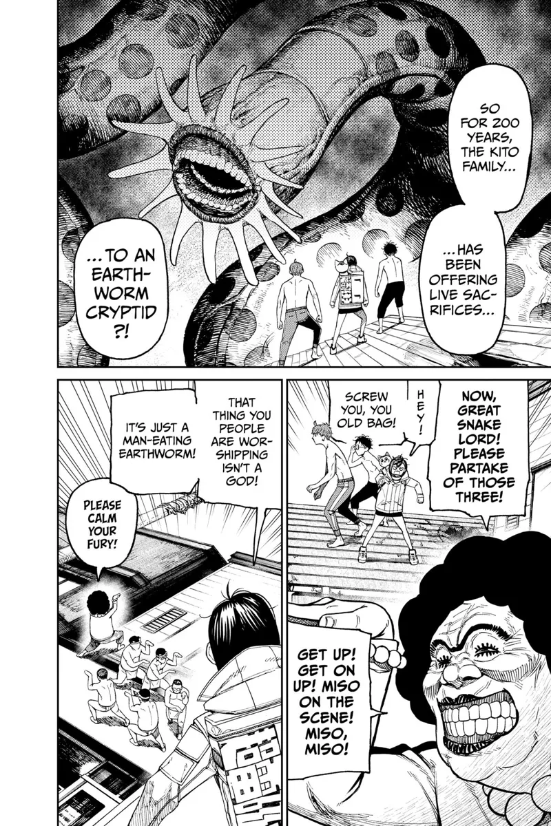 Momo, Okarun, and Jiji stand before the huge Kuragari while the Kito family makes some poses.