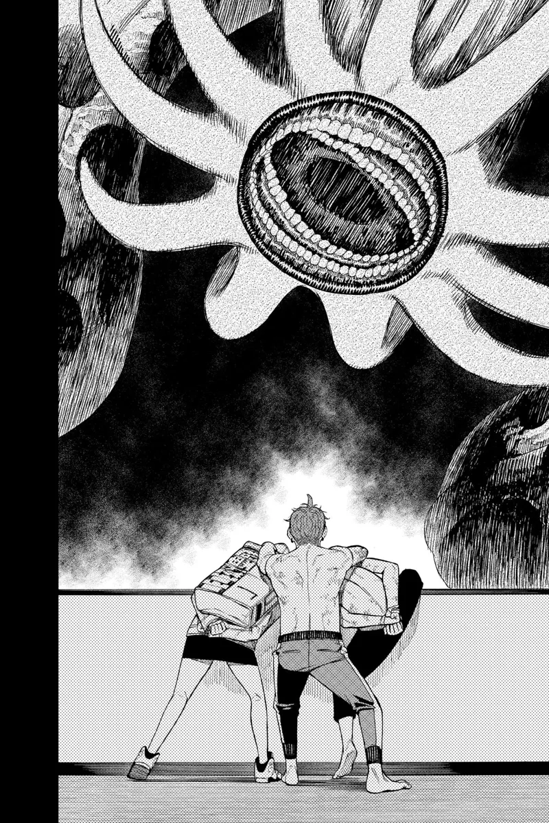 Jiji faces the huge Kuragari snake monster as he holds Momo and Okarun.