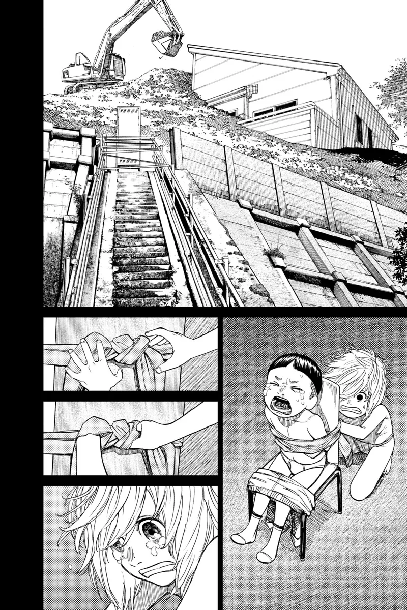 The boy unties the kid, who is tied to a chair, while an excavator covers their house with the ground.