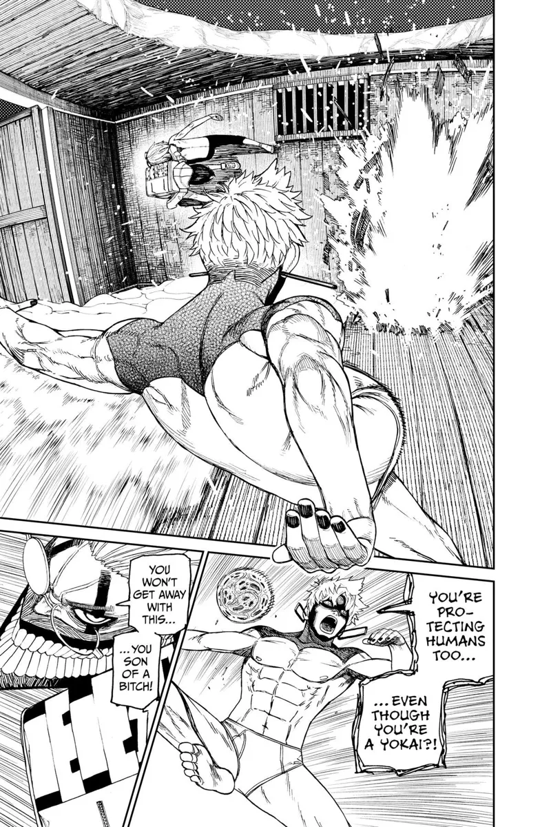 Okarun dodges the spirit ball. Jiji prepares to kick another spirit ball.