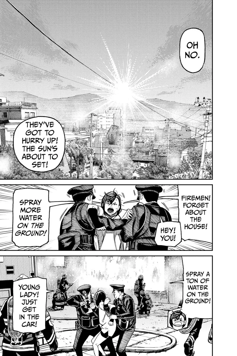 The sun is setting behind the mountains. Two police officers restrain Momo.