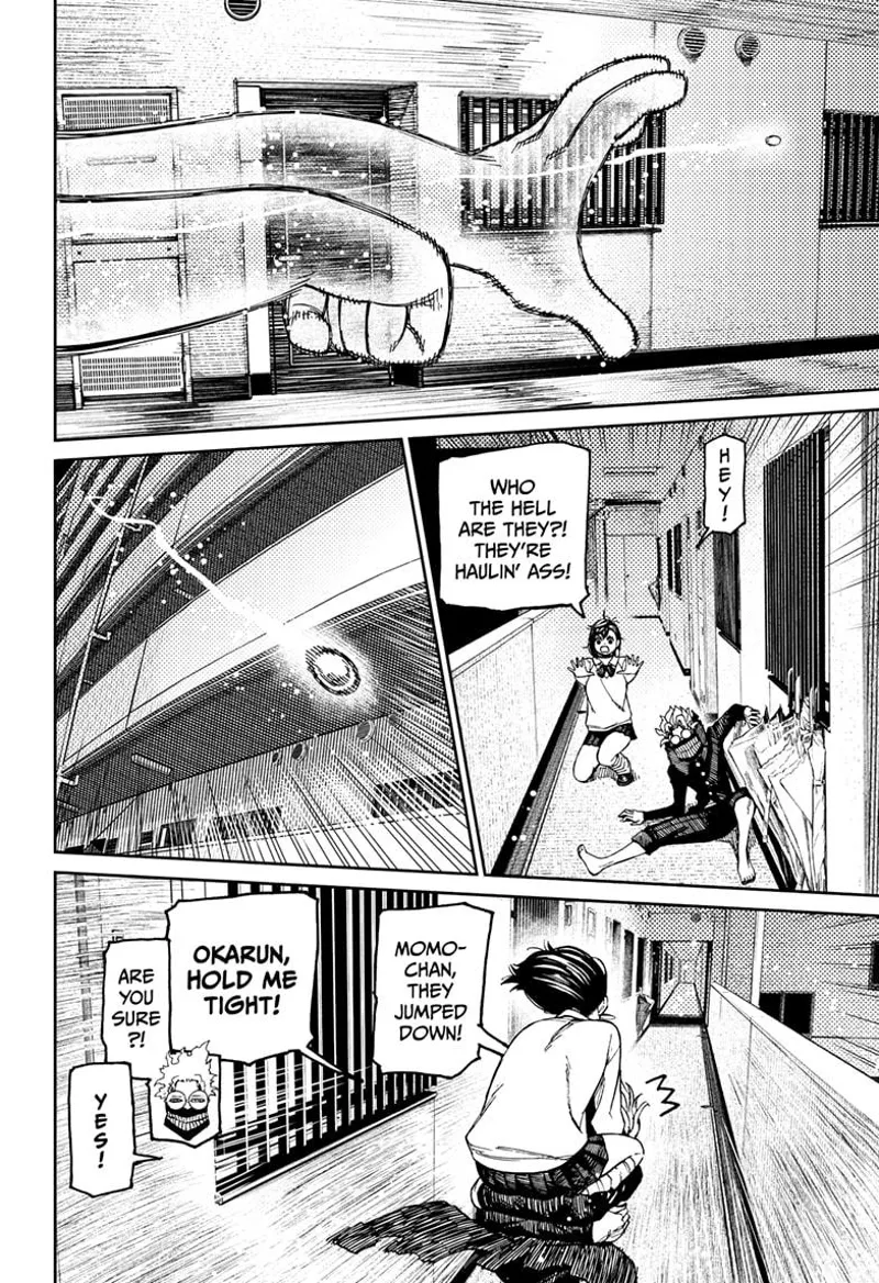 The golden ball jumps off the building. Momo rides behind cursed Okarun as they chase it again.