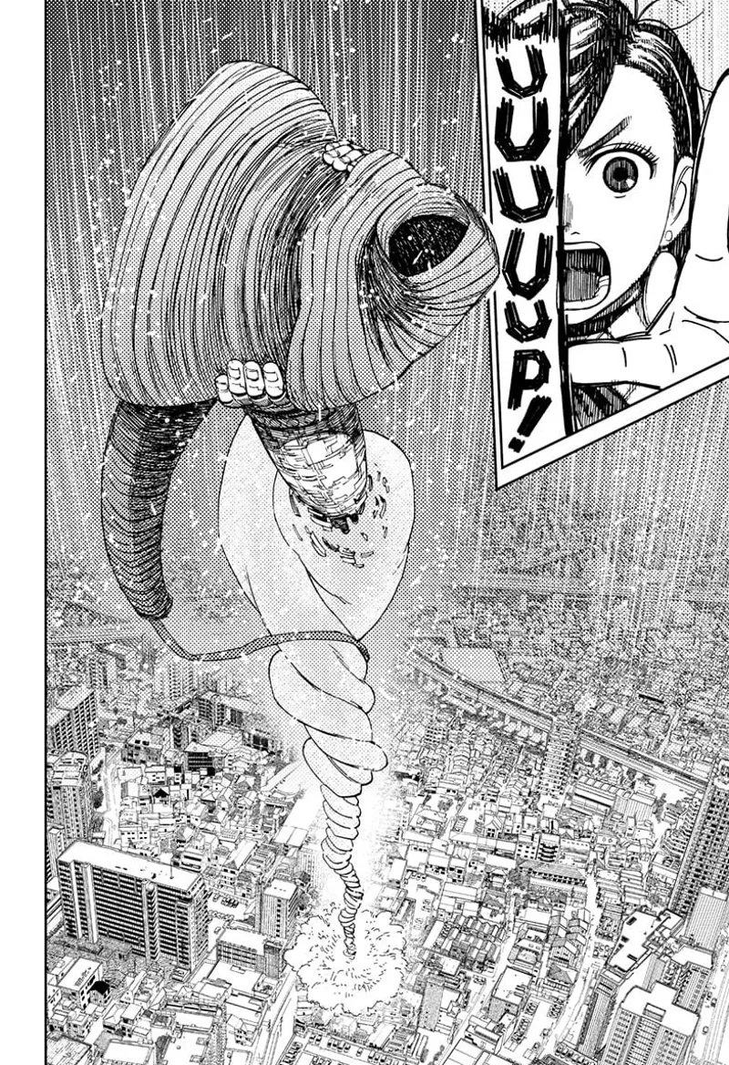 Momo grabs the robot and raises it up in the sky.