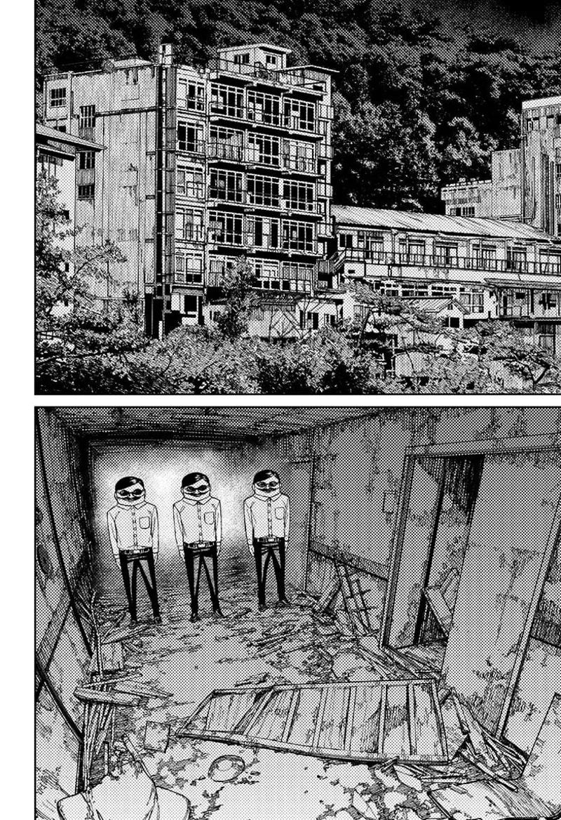 The three Serpoians stand along the dilapidated corridor in an old apartment building.