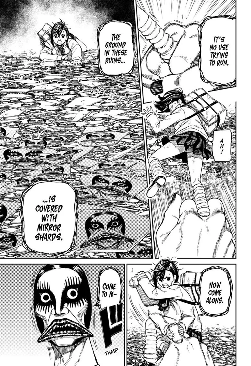 Momo trips and the ugly ghost lady's arm grabs her leg. She sees the ghost's face on the mirror shards on the ground.