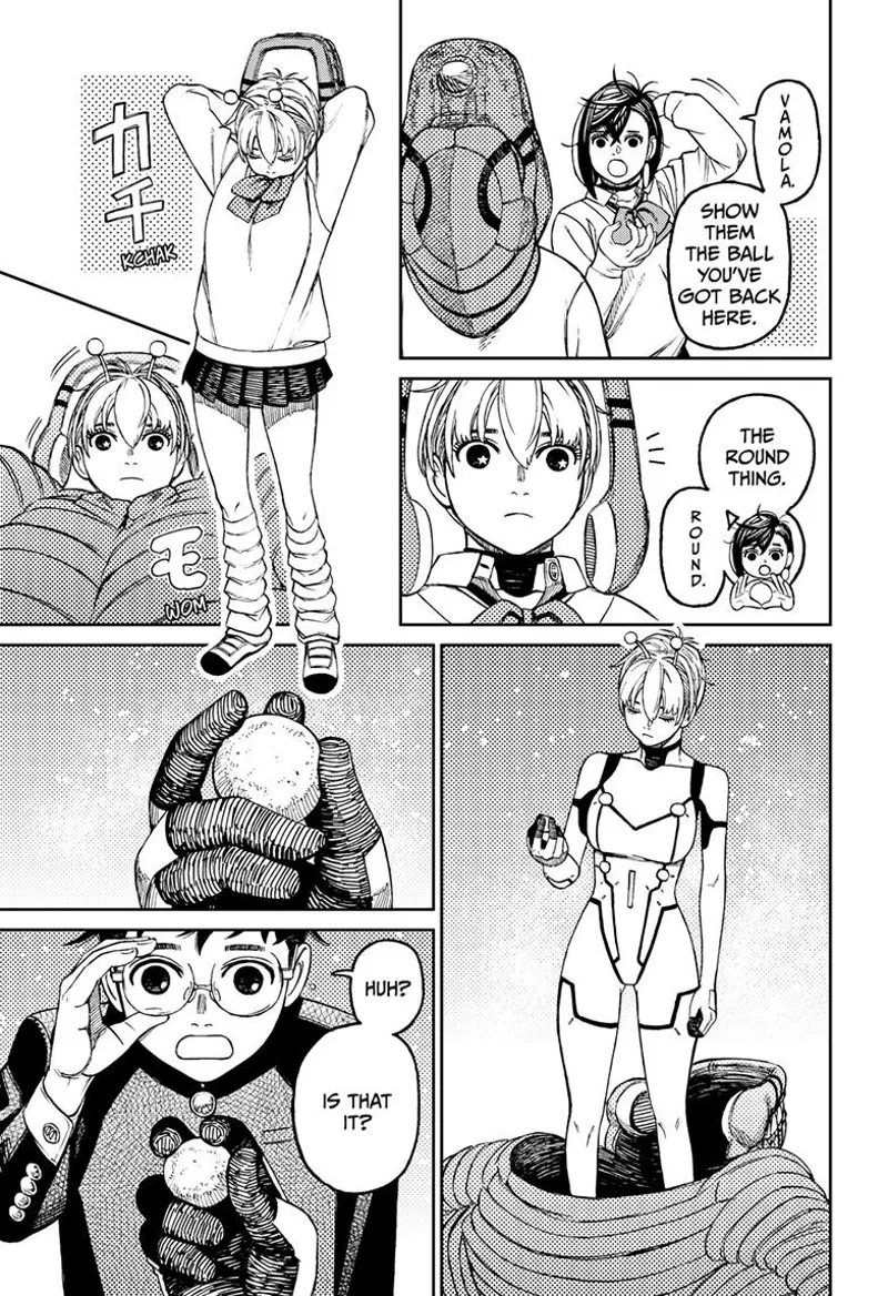 Vamola takes the round ball from her Kaiju suit, changes into alien clothes, and hands it to Okarun.